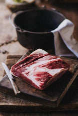 A raw piece of grass fed flat beef brisket.
