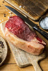 A raw, grass fed, beef sirloin sharing steak ready to be seasoned.